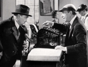 Photo of Lionel Barrymore as Grandpa and Donald Meek as Mr. Poppins.