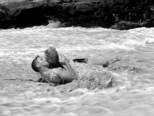 Photo of Burt Lancaster and Deborah Kerr on the beach.