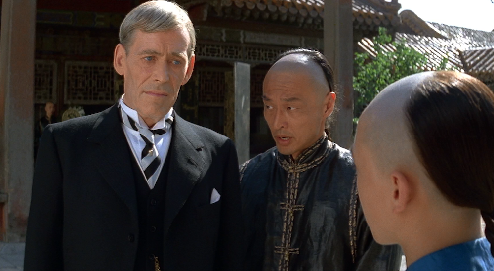 Photo of Peter O'Toole as Reginald Johnston, Cary Hiroyuki Tagawa as Chang, and Wu Tao as Puyi.