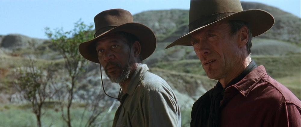 Photo of Morgan Freeman as Ned Logan and Clint Eastwood as Bill Munny.