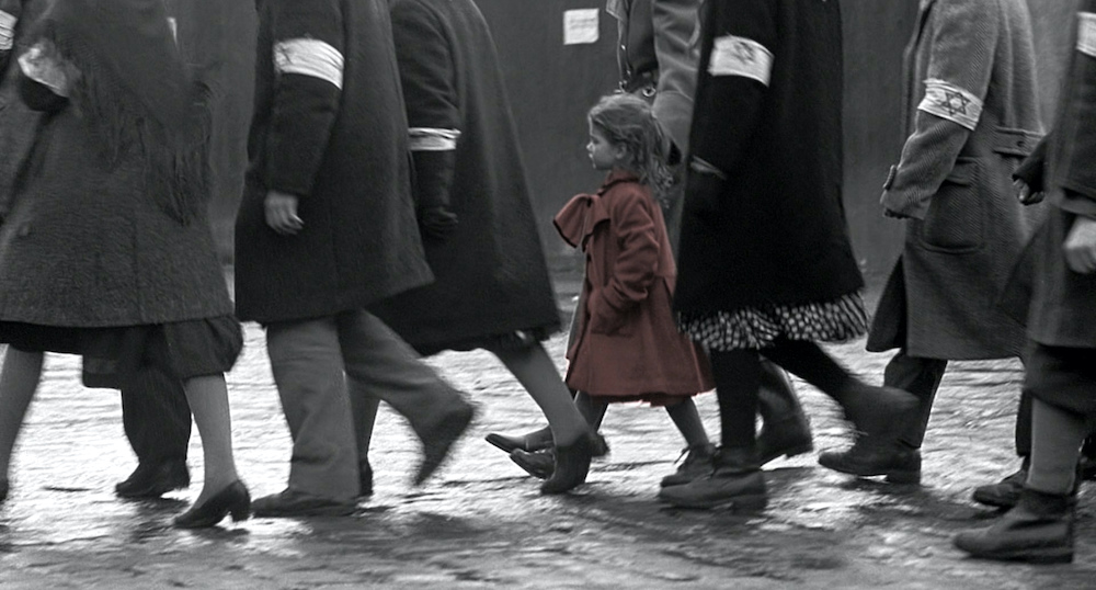 Photo of Oliwia Dabrowska as the little girl in the red coat.