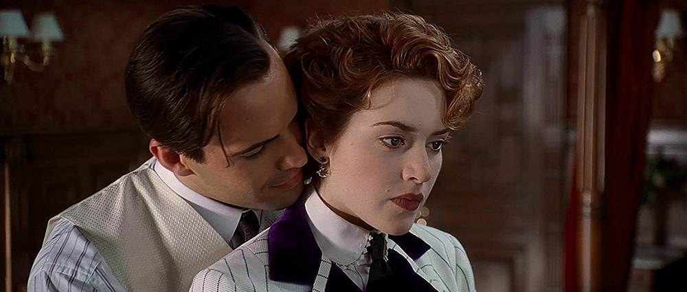 Photo of Billy Zane as Cal and Kate Winslet as Rose.