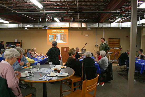 Socializing, dining, and gathering for the presentation on the lower level of the Pioneer Memorial Library in Colby, Kansas.