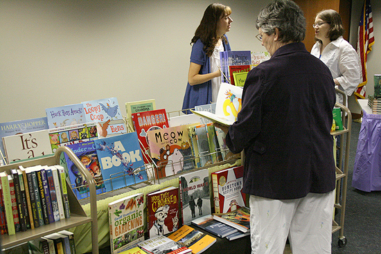 Librarians browse the many books on display and hunt for bargains and "good reads" for their patrons.