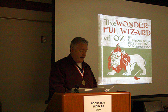 Paul Miles Schneider gives a short presentation on the creative genesis of his novel "Silver Shoes" at the NCKLS Annual Book Fair in Manhattan, Kansas. 2011.