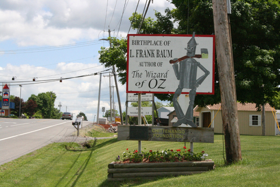 A jolly roadside sign welcomes all travelers to the birthplace of Oz author and creator L. Frank Baum.