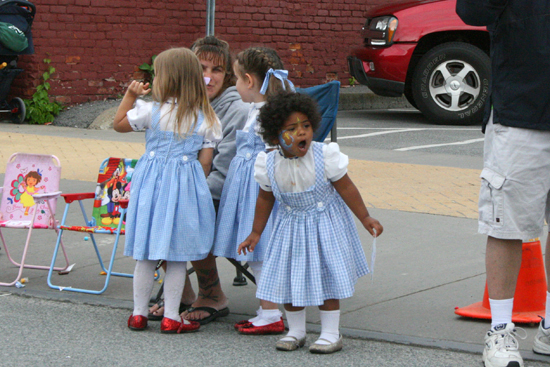 A gaggle of Dorothys observe this year's parade during Oz-Stravaganza! 2012. One adorable child in front happens to be wearing Silver Shoes!