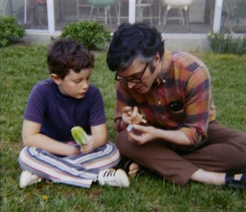 My dad Leonard Schneider and me looking at a robin's egg in our backyard in Lawrence, Kansas, around 1972.