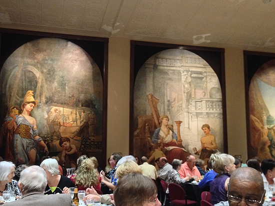 Beautiful, oversized murals surround an evening of great food and music at the Peddicord Playhouse in the historic Columbian Theatre. Wamego, Kansas. 2013.
