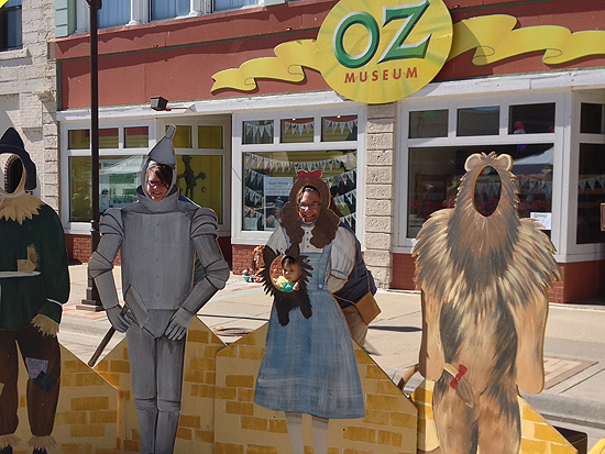 A tiny Toto peeks through with the help of Mom as Dorothy, posing for a photo op outside the Oz Museum in Wamego, Kansas. OZtoberFest 2013.