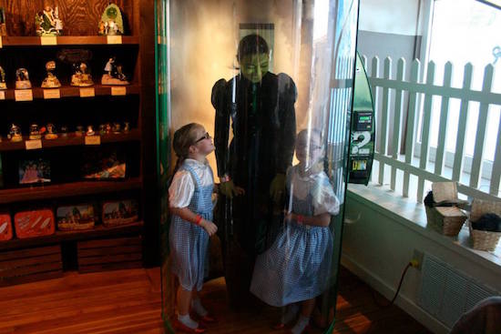 Twin Glindas returned the next day as twin Dorothys with their mother, dressed as the Wicked Witch! Dad was the Tin Man, taking photos while this trio stepped inside the Tornado Simulation Machine in the museum's gift shop. OZtoberFest 2014, Wamego, Kansas.