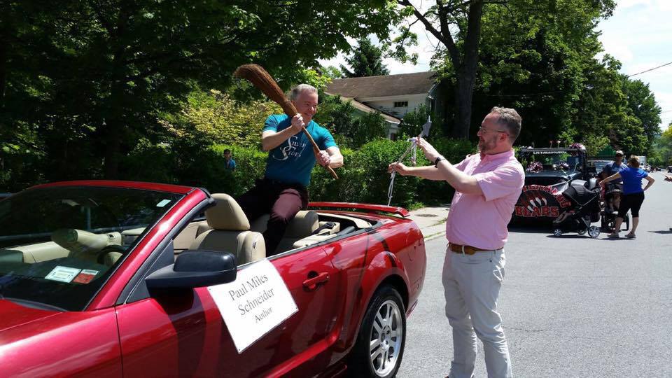 Good vs. Evil at the parade for Oz-Stravaganza 2016, as Paul Miles Schneider and Grant Menzies battle with a wand and broom. All in good fun. Authors of "Silver Shoes" and "Mrs. Ziegfeld," respectively.