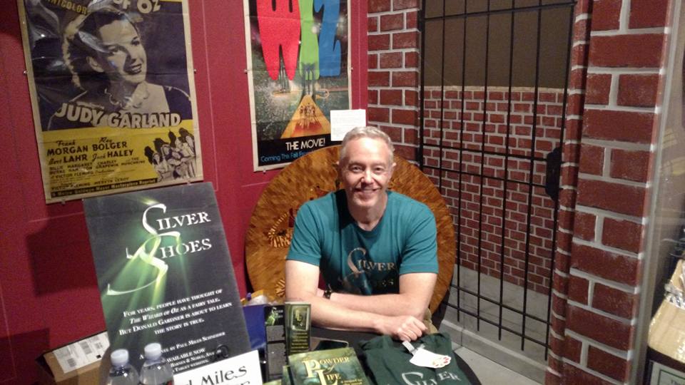 Author Paul Miles Schneider sits at his traditional perch in the Oz Museum for OZtoberFest 2016, in Wamego, KS. Selling and signing books.