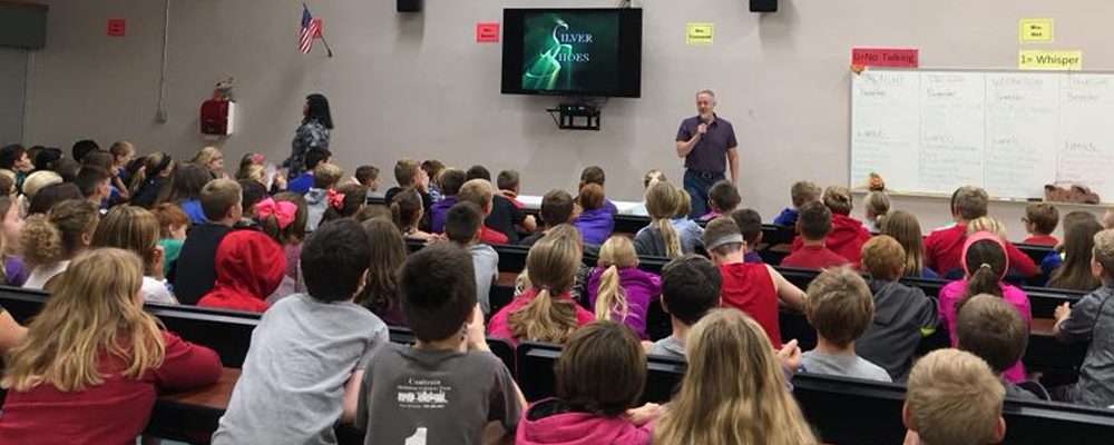 Paul Miles Schneider speaks to students about Silver Shoes.