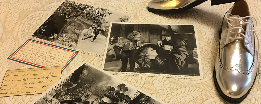 Paul Miles Schneider's photos and post cards by Margaret Hamilton, with his Silver Shoes.